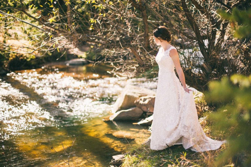 028 Evergreen Lake House Wedding Photographer bride by the river