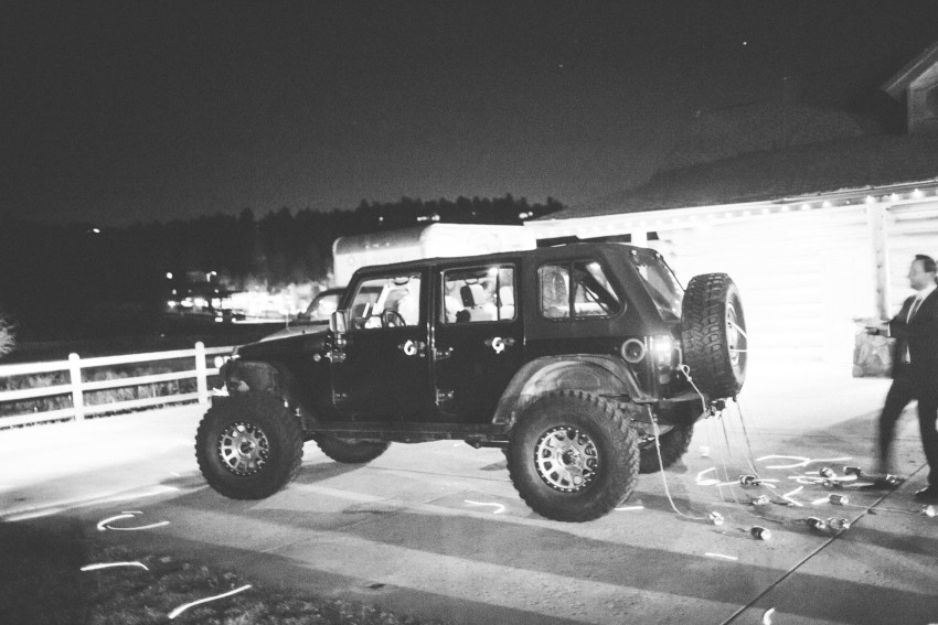 081 Evergreen Lake House Wedding Photographer wedding send off cans tied behind jeep car