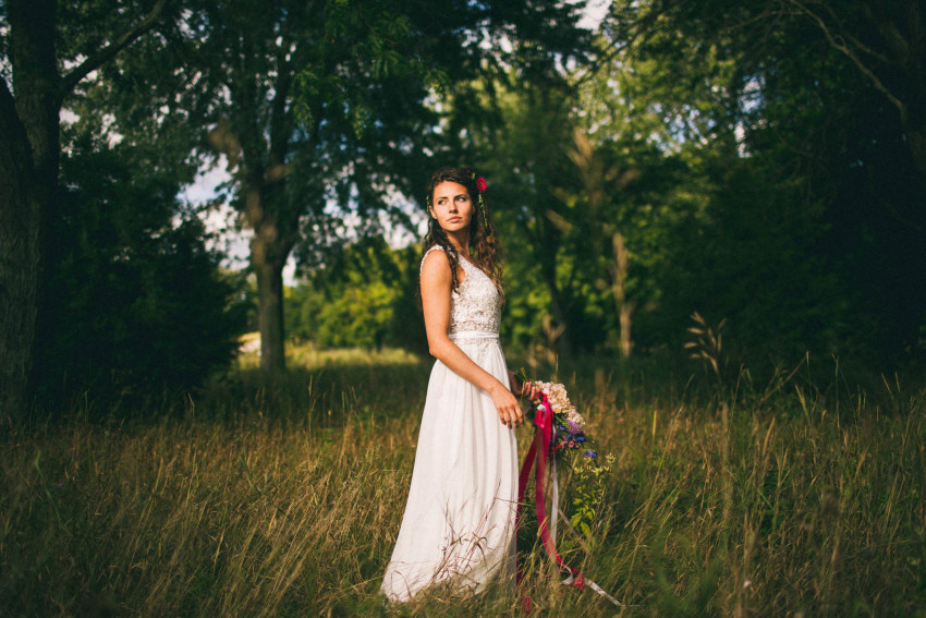 065 Mukwonago Milwaukee WI Barn DIY Laid-back Beautiful Landscape photo of bride in grass wedding Danny Andrea