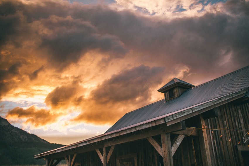 082 Crested Butte CO Private Ranch Wedding Local Foodie Stormy Rain Unique Initimate Burning of Sage Ceremony Barn Live Band Marquee Lights Stars Night Sky