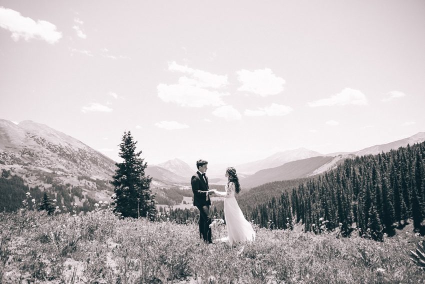 bride and groom portrait with mountain view background