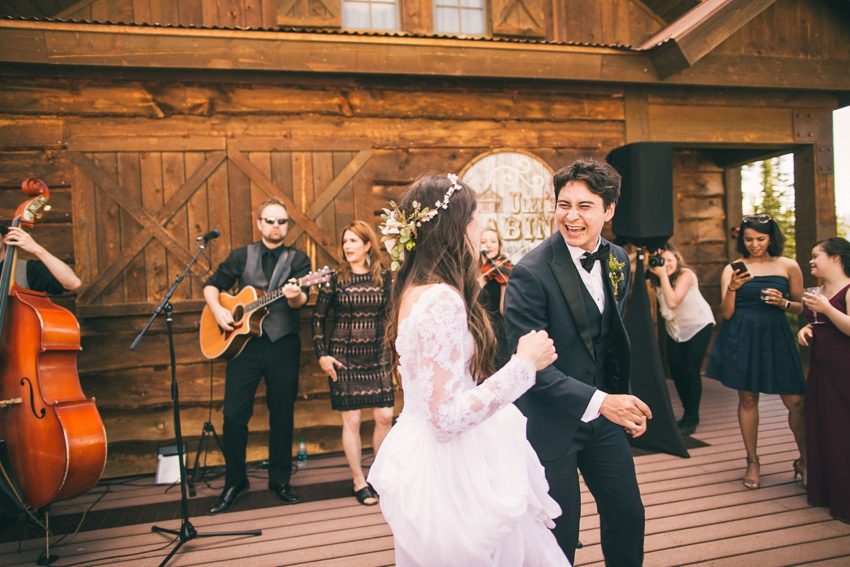 bride dancing to the radio band out of denver at crested butte uleys cabin