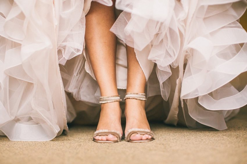 Pretty detail of bride with shoes on