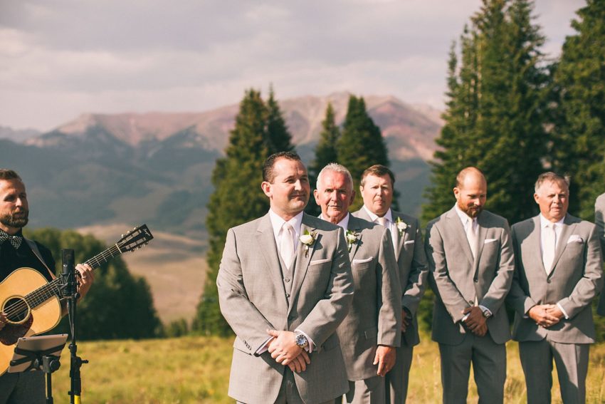 Groom's face waiting for bride down the aisle