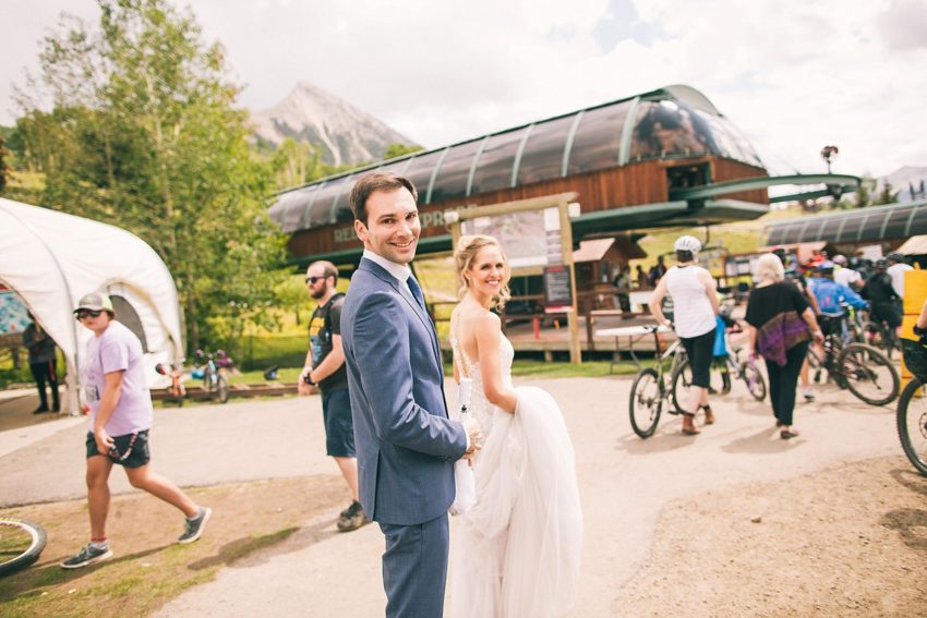 bride groom heading to the crested butte red lady express ski lift
