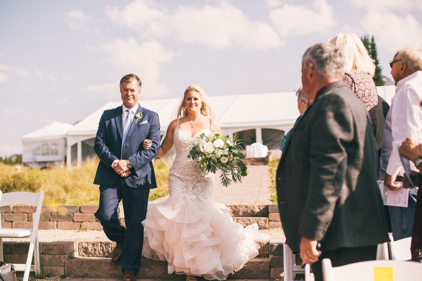 Dad walking daughter down the aisle ten peaks crested butte