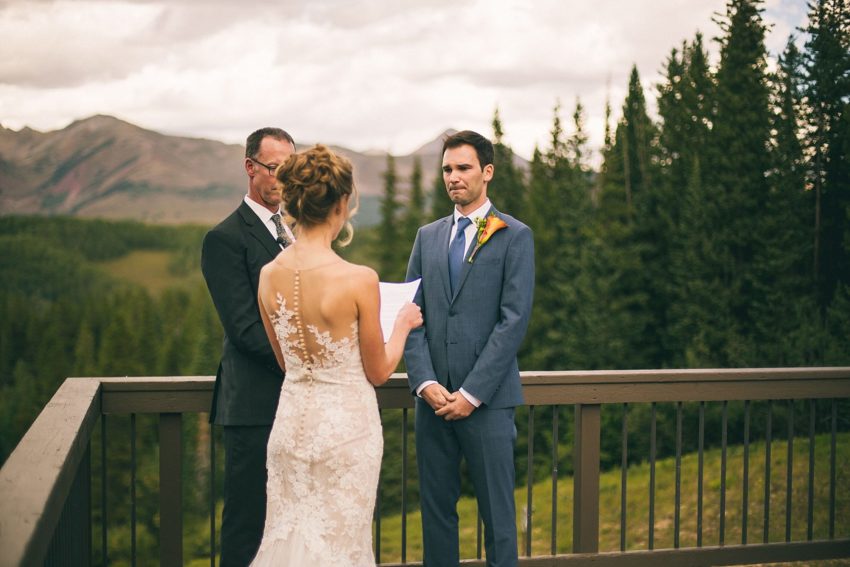 emotional groom trying to hold it together during wedding ceremony