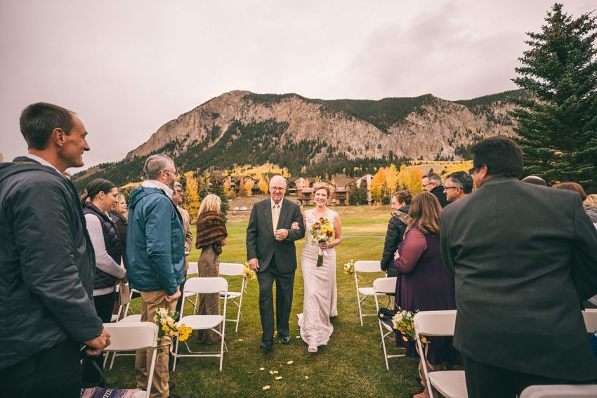 Bride walking down the aisle club of crested butte