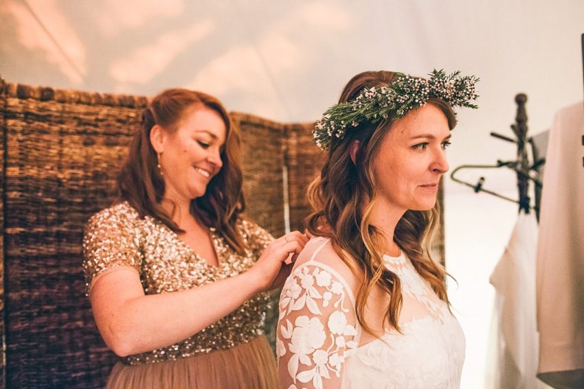 Bride getting dressed wedding day