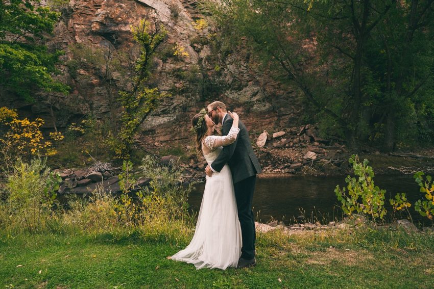 Bride and groom's first look on wedding day Rock face river Bend lyons Colorado