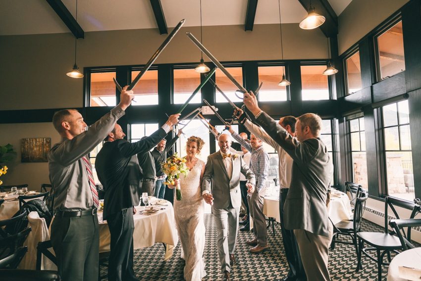 bride and groom grand entrance club of crested butte with ice axe