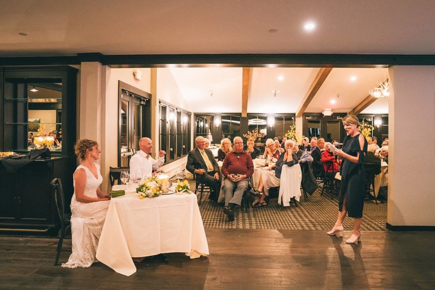 bride and groom enjoying wedding reception toasts