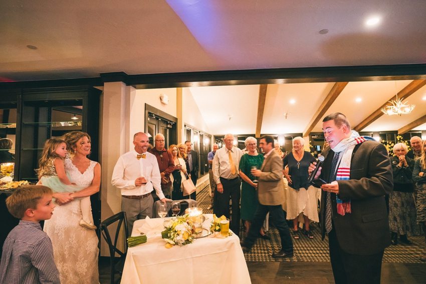 bride and groom enjoying wedding reception toasts