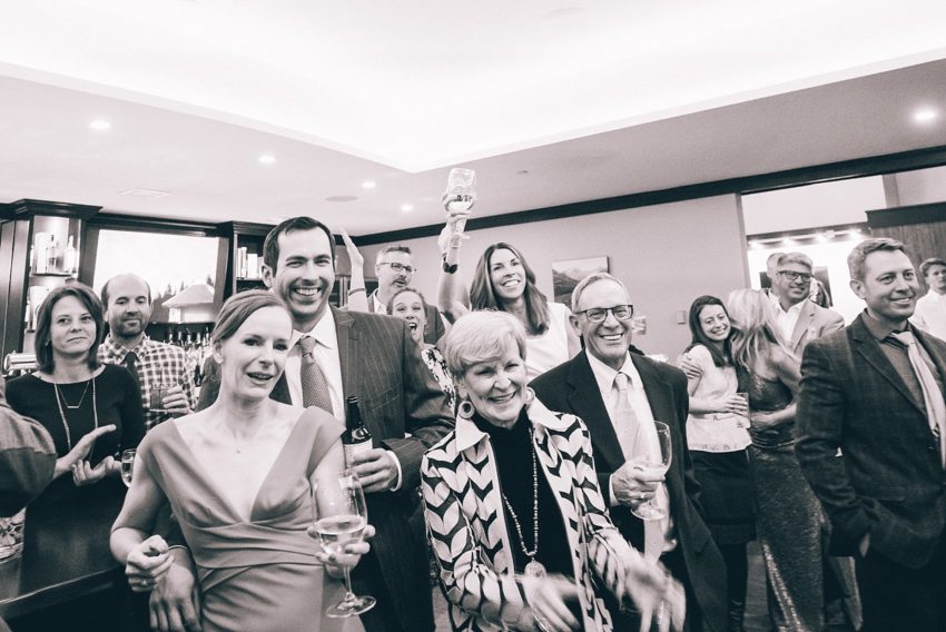 wedding guests toasting bride and groom