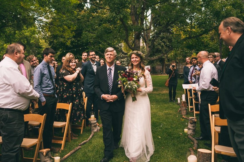 Bride walks down the aisle with her father