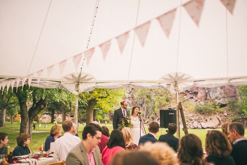Bride and groom thanking wedding guests for coming