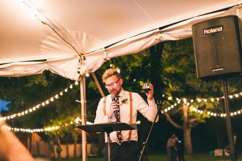 Best man giving a toast to Bride and groom