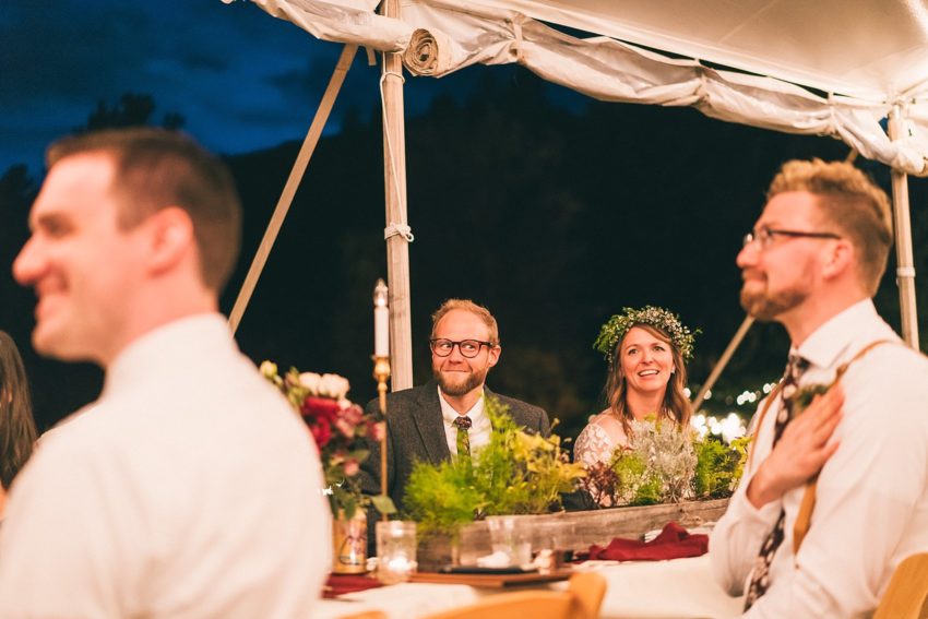 Groom's reaction to toasts during wedding reception