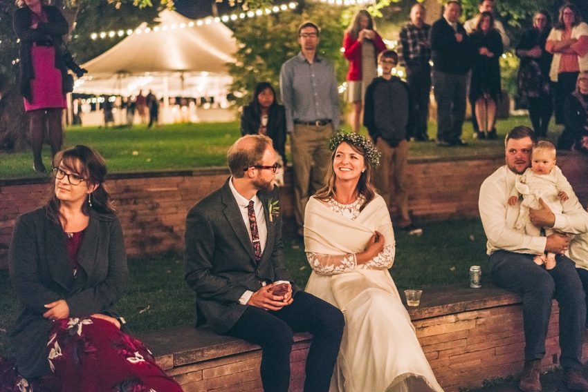 Bride and groom during wedding reception outdoors