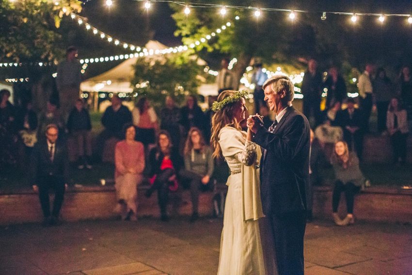 Bride and enjoying a dance with father during father daughter dance