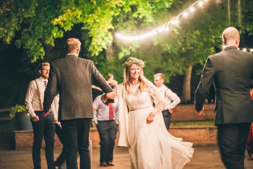 Bride and groom enjoying dancing with wedding guests